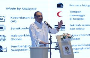 Which book says 1MDB debts are all paid? Anwar wants to know